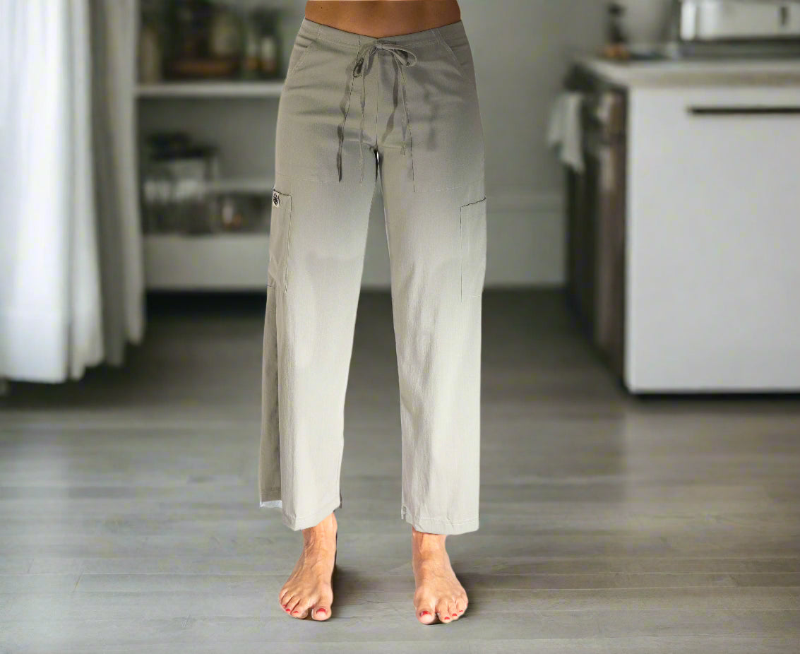 Light green sage pants, slightly cropped, landing at the ankle with  back slits and 2 large cargo pockets & drawstring waist 