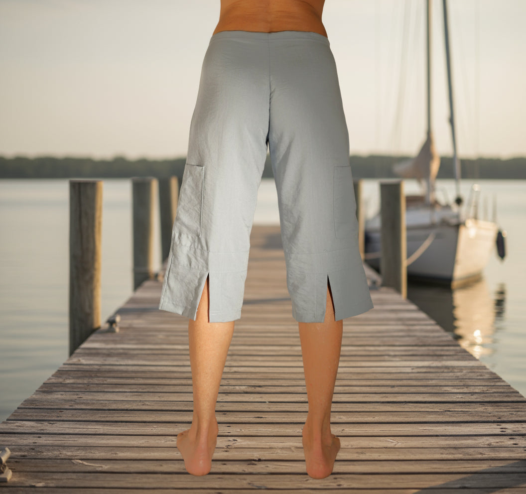 Light gray capri pants on a plain background