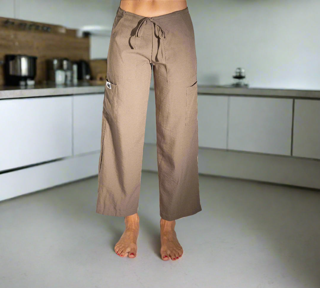 Women's eco-friendly Olive Green Freedom Pant in sustainable Tencel fabric — wide-leg yoga pants with drawstring waist and cargo pockets showing the view from the front